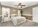 Bedroom with neutral walls, a ceiling fan, and a plush bed with soft decorative pillows at 3905 Song Sparrow Dr, Wake Forest, NC 27587