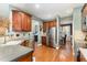 Functional kitchen with stainless steel appliances, wooden cabinets, and an open layout to the dining area at 3905 Song Sparrow Dr, Wake Forest, NC 27587