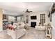 Spacious living room with a fireplace, comfortable seating, and an open view to the dining area at 3905 Song Sparrow Dr, Wake Forest, NC 27587