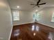 Bright bedroom with hardwood floors and ceiling fan at 401 Commonwealth St St, Durham, NC 27703