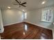 Bright bedroom with hardwood floors and ceiling fan at 401 Commonwealth St St, Durham, NC 27703