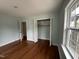Bedroom with hardwood floors and a large closet at 401 Commonwealth St St, Durham, NC 27703