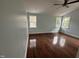 Spacious bedroom with hardwood floors and multiple windows at 401 Commonwealth St St, Durham, NC 27703