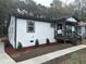 Newly constructed home features a charming front porch and landscaped yard at 401 Commonwealth St St, Durham, NC 27703