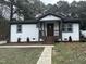 Newly constructed home features a charming front porch and landscaped yard at 401 Commonwealth St St, Durham, NC 27703
