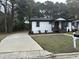 Newly renovated home with a long driveway and landscaped yard at 401 Commonwealth St St, Durham, NC 27703