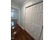 Hallway with hardwood floors and built-in storage at 401 Commonwealth St St, Durham, NC 27703