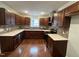 Modern kitchen with dark wood cabinets and quartz countertops at 401 Commonwealth St St, Durham, NC 27703
