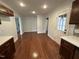 Modern kitchen with dark wood cabinets and quartz countertops at 401 Commonwealth St St, Durham, NC 27703
