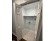 Small laundry room with shelving and tile floor at 401 Commonwealth St St, Durham, NC 27703