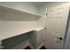 Laundry area with shelving and folding counter at 401 Commonwealth St St, Durham, NC 27703