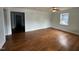 Spacious living room featuring hardwood floors and light blue walls at 401 Commonwealth St St, Durham, NC 27703