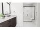 Spa-like bathroom with a large walk-in shower and marble tile at 4081 Elk Creek Ln # 07, Raleigh, NC 27612