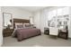 Bright bedroom featuring a comfortable bed and built-in workspace at 4081 Elk Creek Ln # 07, Raleigh, NC 27612