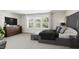 Spacious main bedroom with large windows and plush bedding at 4081 Elk Creek Ln # 07, Raleigh, NC 27612