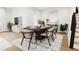 Modern dining room with dark wood table and gray chairs at 4081 Elk Creek Ln # 07, Raleigh, NC 27612