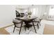 Modern dining room with a large table and six chairs at 4081 Elk Creek Ln # 07, Raleigh, NC 27612
