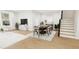 Open concept living and dining area with hardwood floors at 4081 Elk Creek Ln # 07, Raleigh, NC 27612