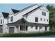 Stunning two-story home with a charming farmhouse exterior at 4081 Elk Creek Ln # 07, Raleigh, NC 27612