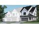 Modern farmhouse style home with gray stone accents and a two-car garage at 4081 Elk Creek Ln # 07, Raleigh, NC 27612
