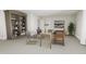 Elegant home office with built-in shelving and a spacious desk at 4081 Elk Creek Ln # 07, Raleigh, NC 27612