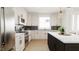 Modern kitchen with stainless steel appliances and an island at 4081 Elk Creek Ln # 07, Raleigh, NC 27612