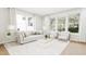 Bright and airy living room with large windows and comfortable seating at 4081 Elk Creek Ln # 07, Raleigh, NC 27612