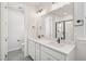 Bathroom with double vanity, quartz countertops, and modern fixtures at 515 Wendover Pkwy, Pittsboro, NC 27312
