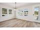 Bright dining area with large windows and wood floors at 515 Wendover Pkwy, Pittsboro, NC 27312