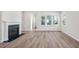 Spacious living room with wood floors and a fireplace at 515 Wendover Pkwy, Pittsboro, NC 27312