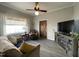 Living room with hardwood floors, a TV, and a cozy armchair at 516 S Flanner St, Burlington, NC 27215