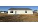 House exterior showcasing a simple backyard at 52 Faucette Dr, Selma, NC 27576