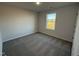 Bright bedroom with a large window and carpet at 52 Faucette Dr, Selma, NC 27576