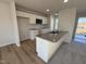 Eat-in kitchen with white cabinets and granite island at 52 Faucette Dr, Selma, NC 27576