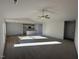 Open living room with vaulted ceiling and kitchen view at 52 Faucette Dr, Selma, NC 27576