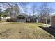 Spacious backyard with deck and screened porch at 5705 Larchwood Dr, Raleigh, NC 27609