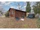 Rear exterior view featuring wood siding and outdoor utilities at 620 S Mebane St, Burlington, NC 27215