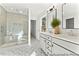 Spa-like bathroom with walk-in shower, double vanity, and patterned tile floor at 292 Nathan Dr # 46P, Lillington, NC 27546