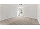 Well-lit bedroom with neutral carpeting at 292 Nathan Dr # 46P, Lillington, NC 27546