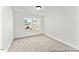 Bright bedroom featuring neutral carpeting and natural light at 292 Nathan Dr # 46P, Lillington, NC 27546