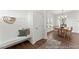 Bright entryway with built-in bench, coat hooks, and view into dining area at 292 Nathan Dr # 46P, Lillington, NC 27546