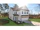 Two-story house with gray and white exterior, two-car garage, and landscaped lawn at 292 Nathan Dr # 46P, Lillington, NC 27546