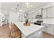 Modern kitchen with gray cabinets, white countertops, and an island with seating at 64 Mable Court # 19P, Lillington, NC 27546