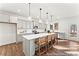 Modern kitchen with gray cabinets, white countertops, and an island with seating at 64 Mable Court # 19P, Lillington, NC 27546