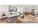 Living room with light walls, comfortable sofa, and view into kitchen area at 292 Nathan Dr # 46P, Lillington, NC 27546