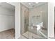 Large walk-in shower with built-in seat and glass enclosure at 292 Nathan Dr # 46P, Lillington, NC 27546