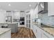 Modern kitchen with stainless steel appliances and granite countertops at 65 Soggy Bottom Trl, Zebulon, NC 27597