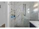 Luxurious shower with marble walls and glass enclosure at 65 Soggy Bottom Trl, Zebulon, NC 27597