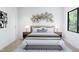 Bedroom with a neutral color scheme and large window at 711 E Lenoir St # 207, Raleigh, NC 27601