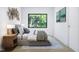 Second bedroom with a window and wood nightstand at 711 E Lenoir St # 207, Raleigh, NC 27601